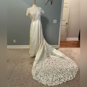 Ivory wedding dress.  Buttons all the way down the back size 16